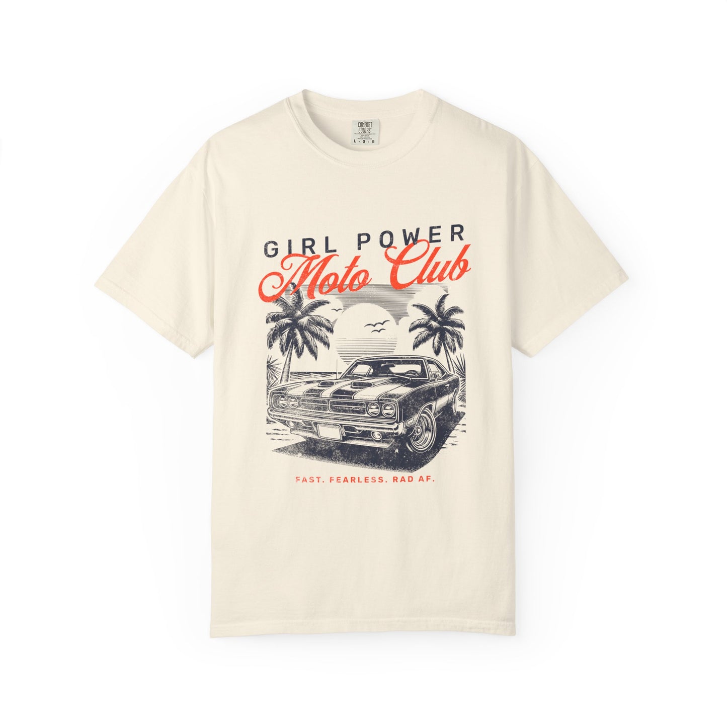 Beige t-shirt with 'Girl Power Moto Club' graphic design featuring a car and palm trees on a white background.