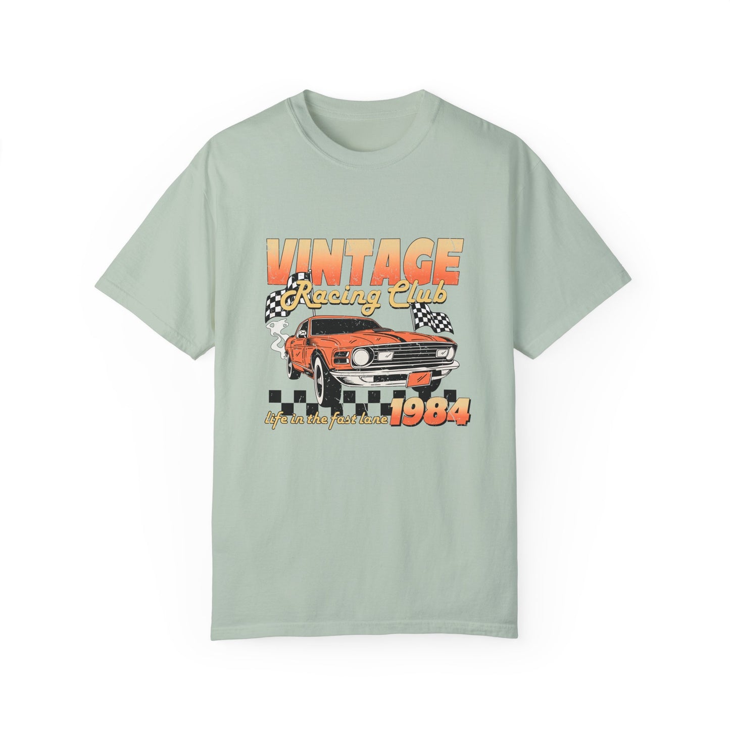 Retro racing T-shirt featuring a bold 1984 vintage design with distressed car graphics. Perfect nostalgic car shirt for muscle car lovers, featuring checkered flag details. Ideal for fans of old school racing and fast lane graphic tees.