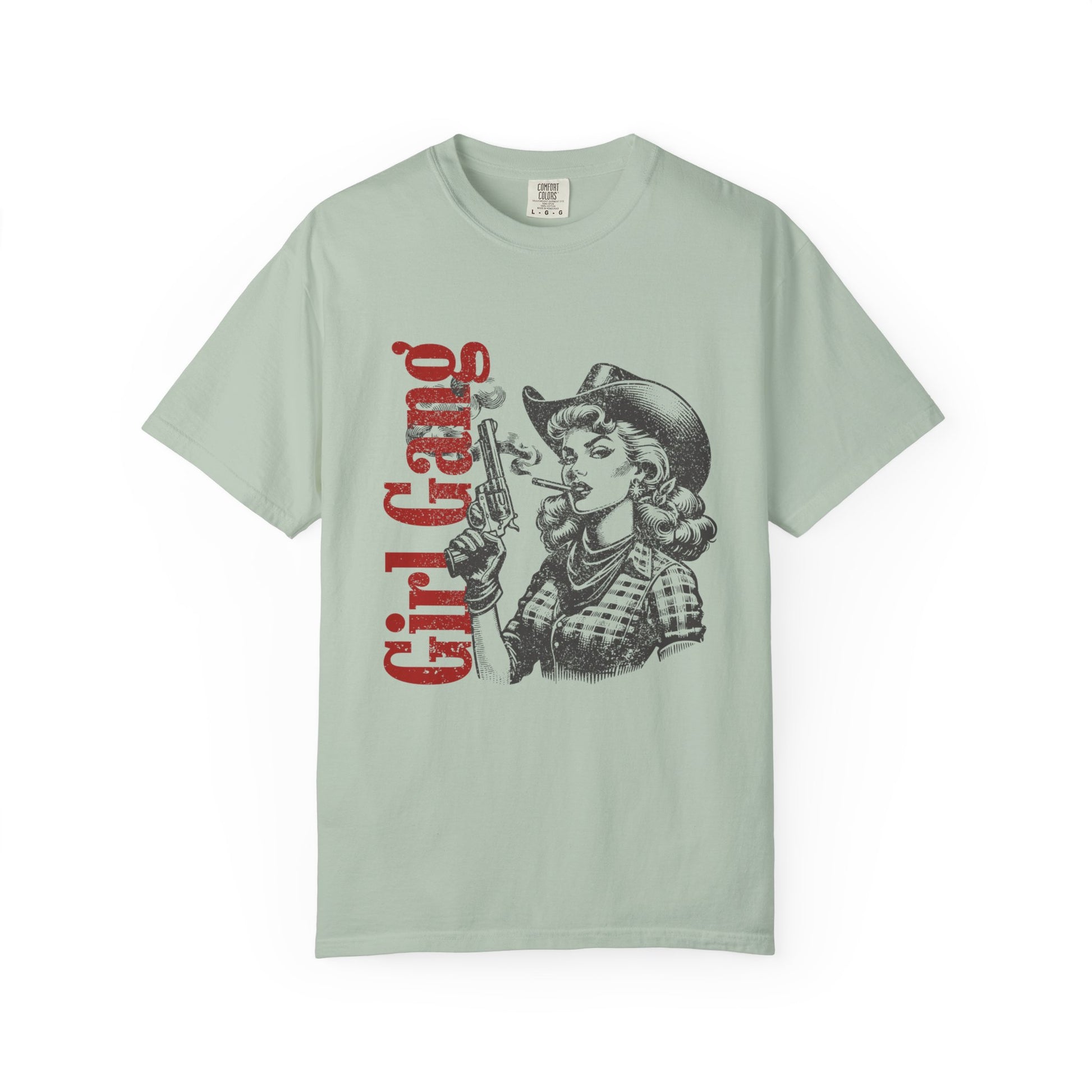 Light green t-shirt with graphic design and 'Girl Gang' text on a white background