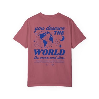 Motivational graphic t-shirt with a celestial design featuring stars, moon, and globe. Includes the inspiring phrase 'you deserve the world.' A trendy and stylish vintage-inspired tee for casual wear, perfect for spreading positivity and empowerment.