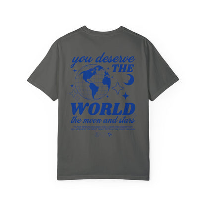 Motivational graphic t-shirt with a celestial design featuring stars, moon, and globe. Includes the inspiring phrase 'you deserve the world.' A trendy and stylish vintage-inspired tee for casual wear, perfect for spreading positivity and empowerment.