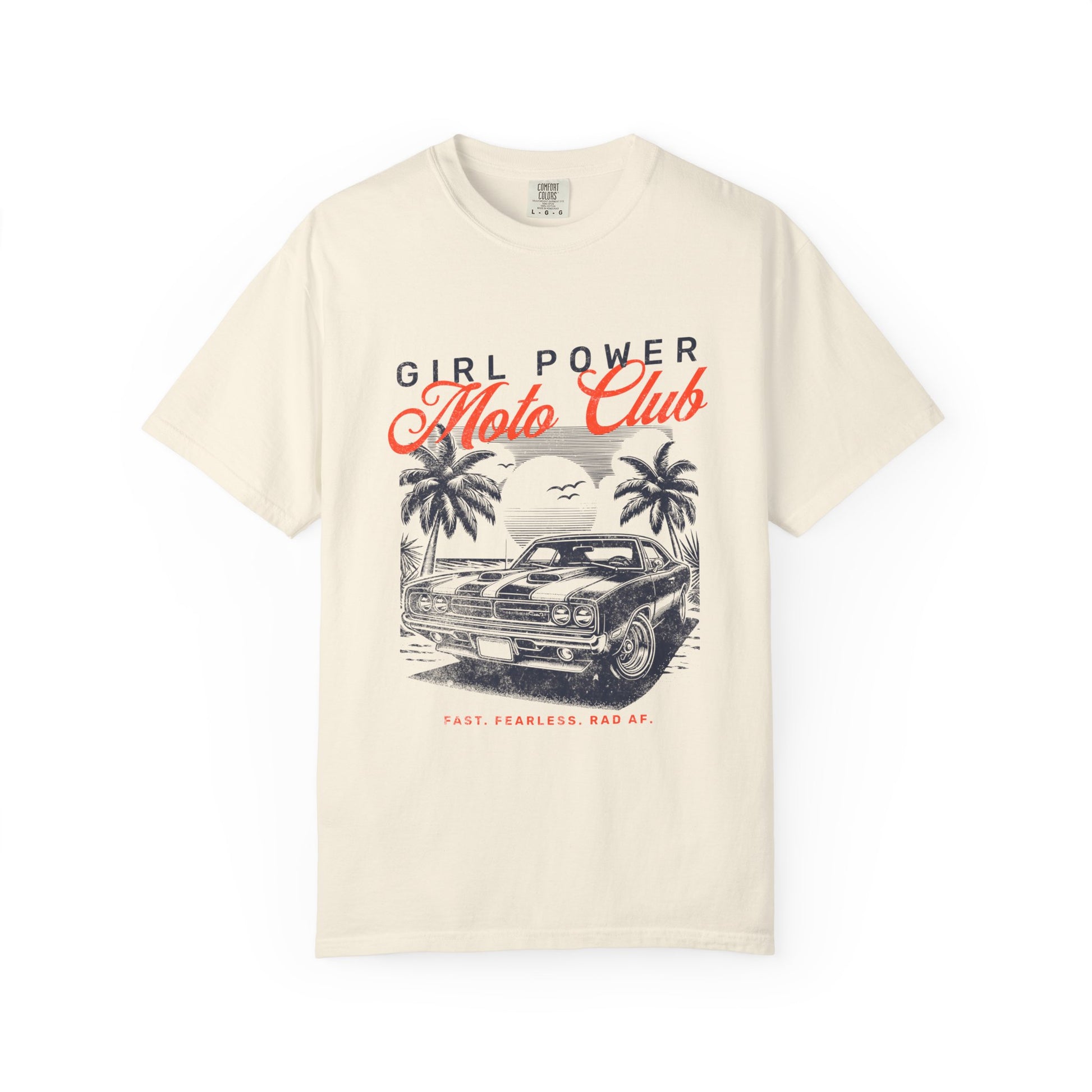 Beige t-shirt with 'Girl Power Moto Club' graphic design featuring a car and palm trees on a white background.