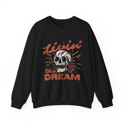 Oversized retro skull sweatshirt with bold vintage-inspired design. Livin' The Dream shirt featuring edgy graphic details. Perfect boho skull pullover for grunge and aesthetic styles. Casual vintage skull sweater ideal for layering and everyday wear. 