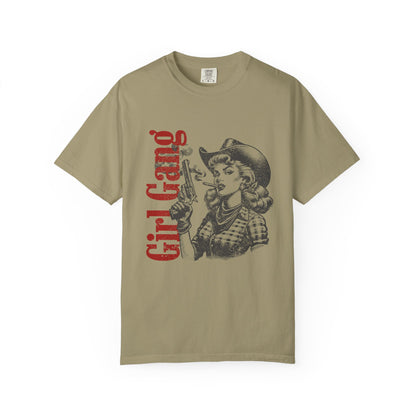 Beige t-shirt with graphic design of a woman in a cowboy hat and 'Girl Gang' text on a white background