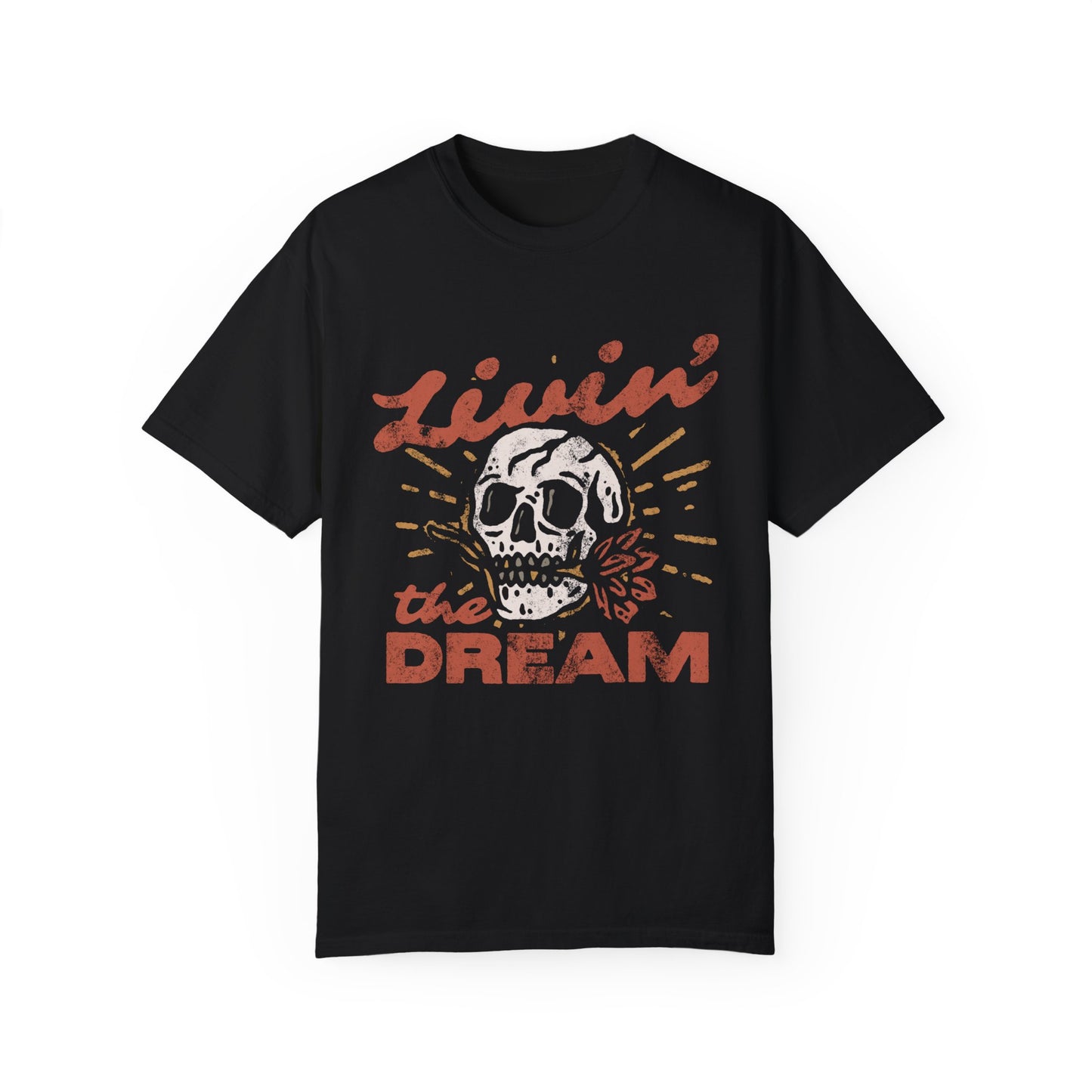 Black t-shirt with a vintage skull graphic, sunburst design, and 'Livin' the Dream' text in retro font. Perfect for a retro skull t-shirt or distressed skull tee look with a boho rocker vibe. Casual vintage t-shirt style for edgy everyday wear.