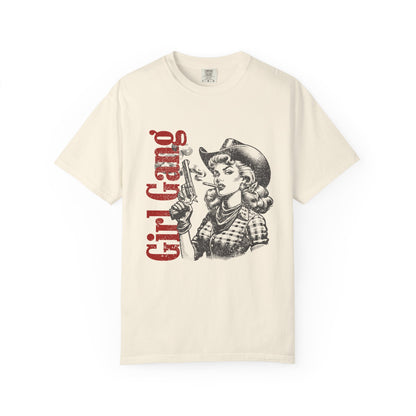 Beige t-shirt with graphic design of a woman in a cowboy hat and 'Girl Gang' text on a white background