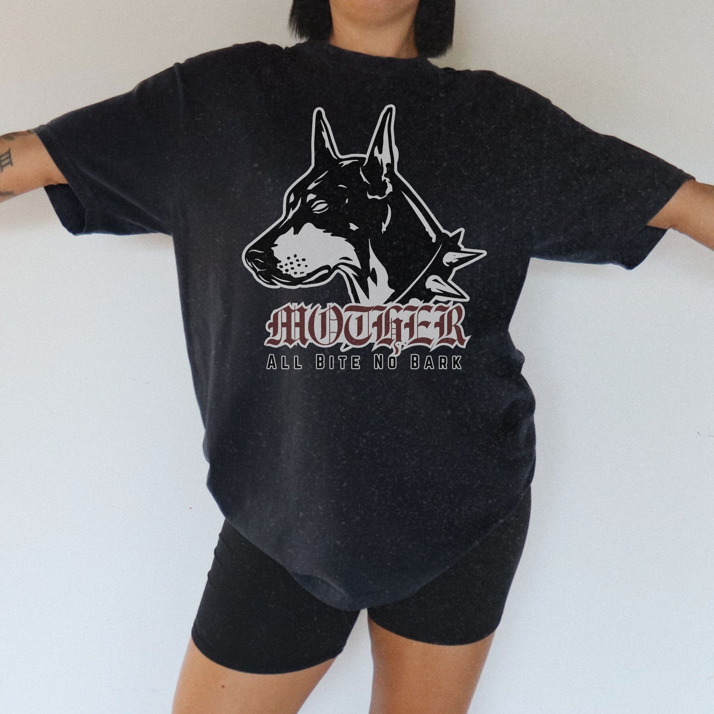 Oversized Doberman Graphic Tee with bold gothic lettering and tattoo style design. Edgy Dog Mom Shirt with punk rock vibe, perfect for streetwear lovers. Retro Mom Graphic Tee with All Bite No Bark statement for bold, confident moms.