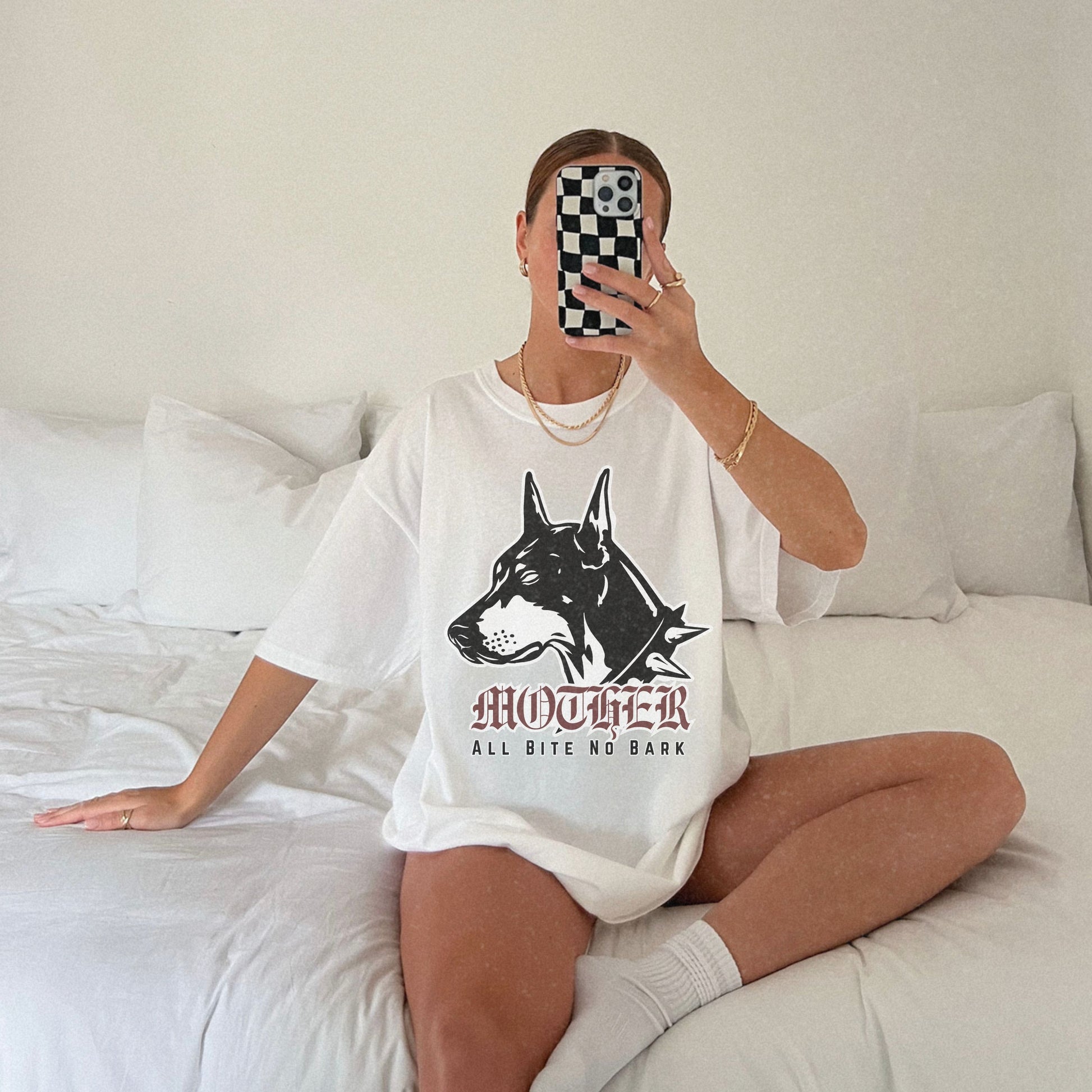 Oversized Doberman Graphic Tee with bold gothic lettering and tattoo style design. Edgy Dog Mom Shirt with punk rock vibe, perfect for streetwear lovers. Retro Mom Graphic Tee with All Bite No Bark statement for bold, confident moms.