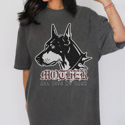 Oversized Doberman Graphic Tee with bold gothic lettering and tattoo style design. Edgy Dog Mom Shirt with punk rock vibe, perfect for streetwear lovers. Retro Mom Graphic Tee with All Bite No Bark statement for bold, confident moms.