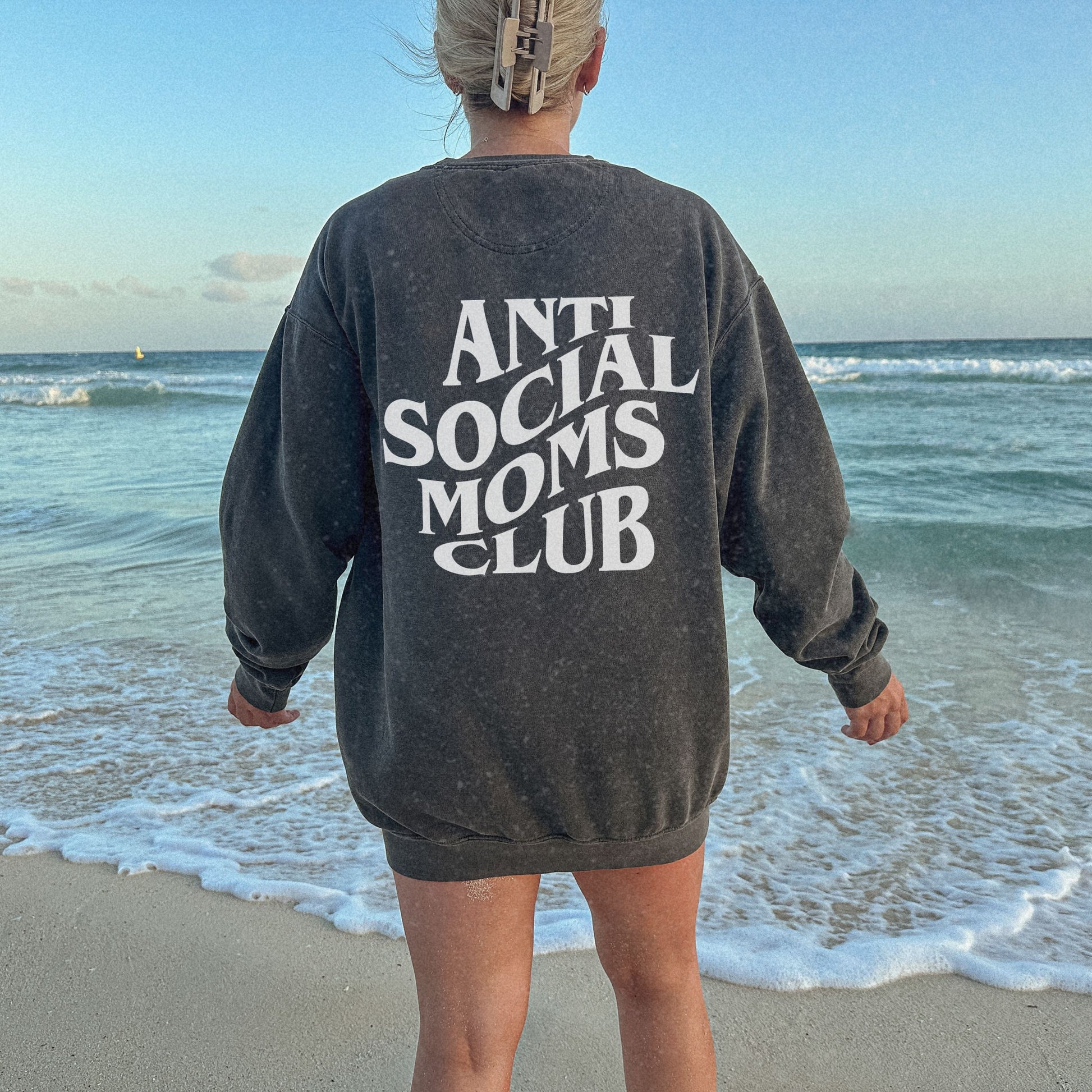 Anti Social Moms Club sweatshirt with bold graphic text on the back. Perfect funny mom sweatshirt or vintage mom pullover for casual wear. Stylish, oversized fit for a comfy mom sweatshirt, ideal gift for moms who love humor and relaxed style.