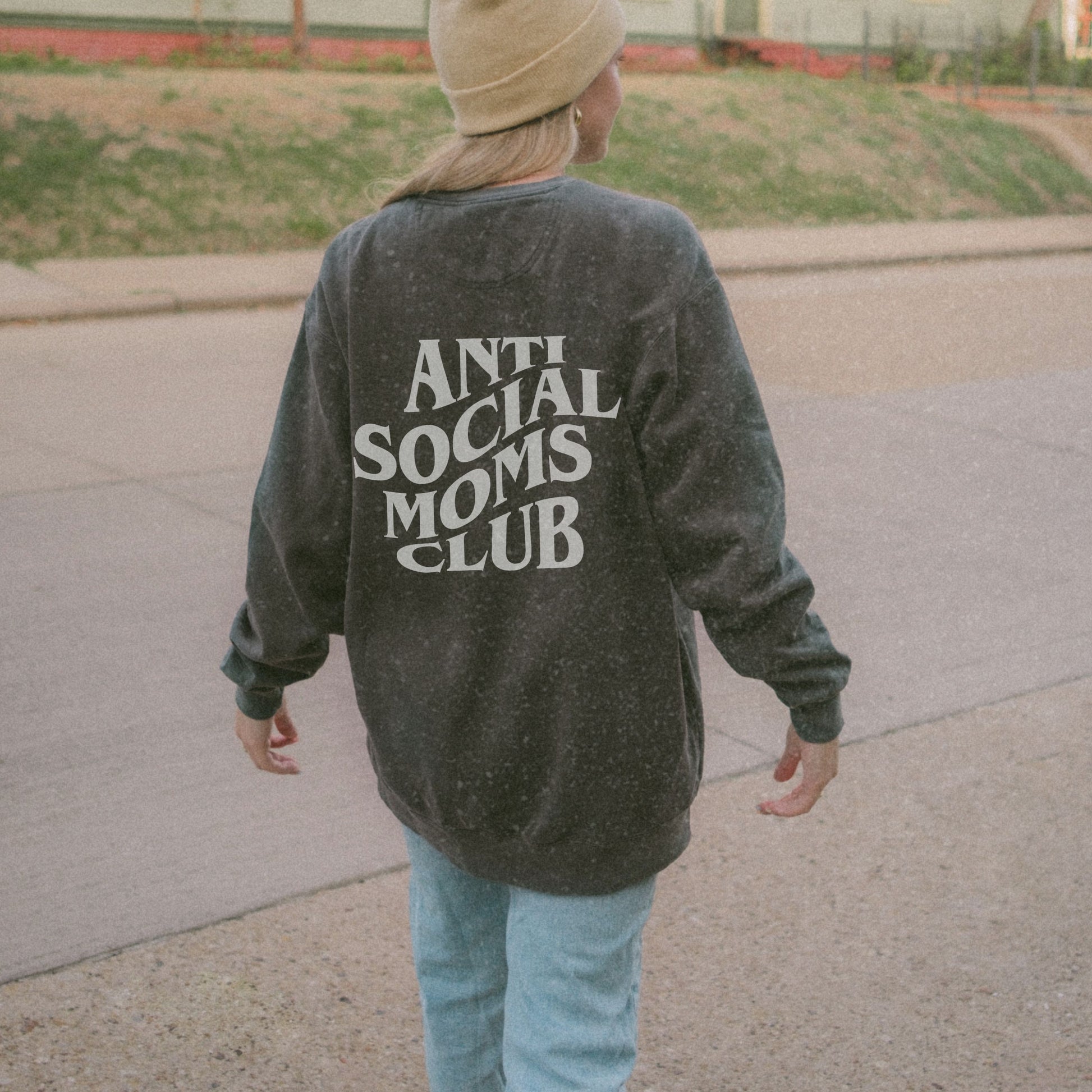 Anti Social Moms Club sweatshirt with bold graphic text on the back. Perfect funny mom sweatshirt or vintage mom pullover for casual wear. Stylish, oversized fit for a comfy mom sweatshirt, ideal gift for moms who love humor and relaxed style.