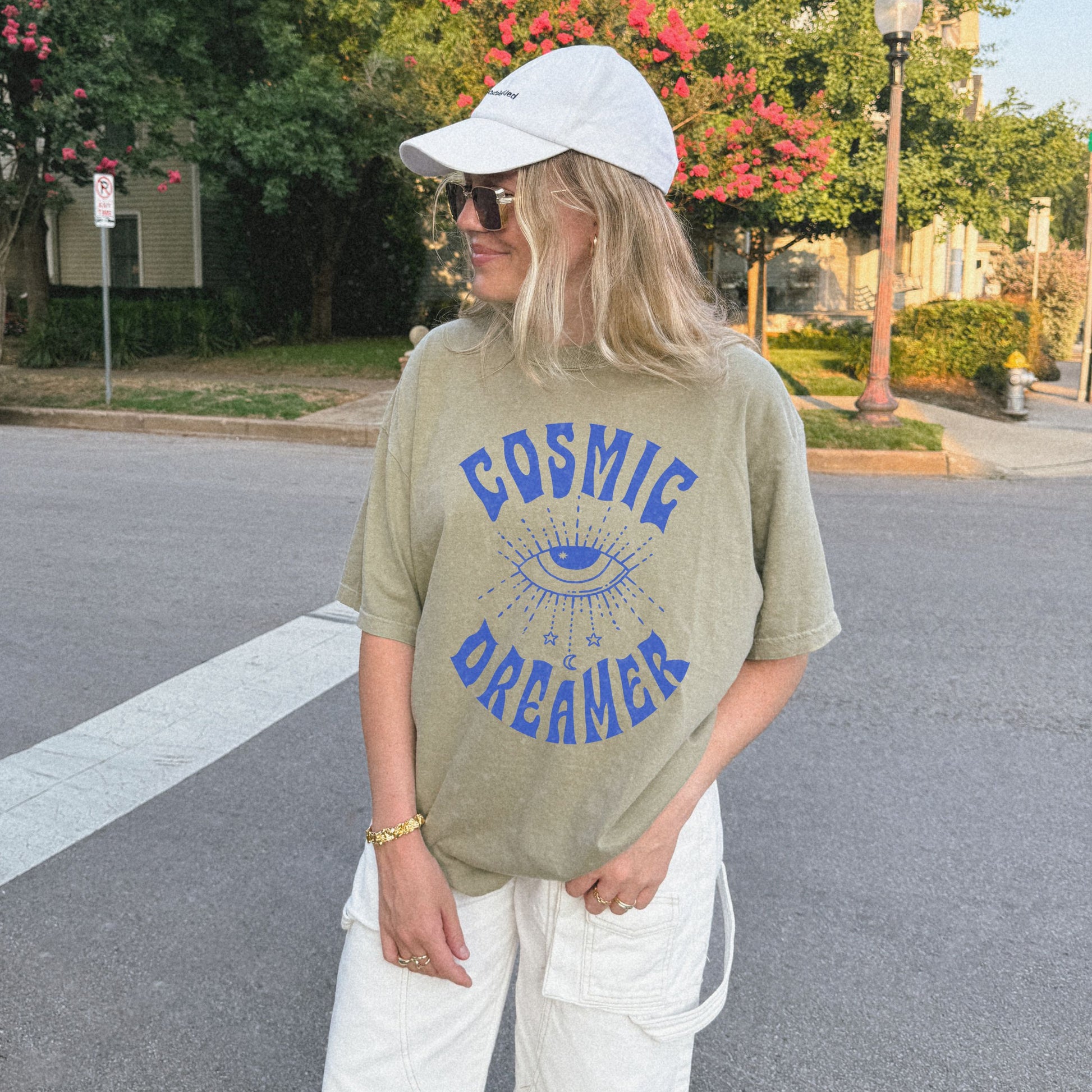 Mystical graphic tee featuring a spiritual eye, cosmic dreamer typography, and celestial design. Perfect for vintage-inspired outfits, boho rebel style, and night sky aesthetics.
