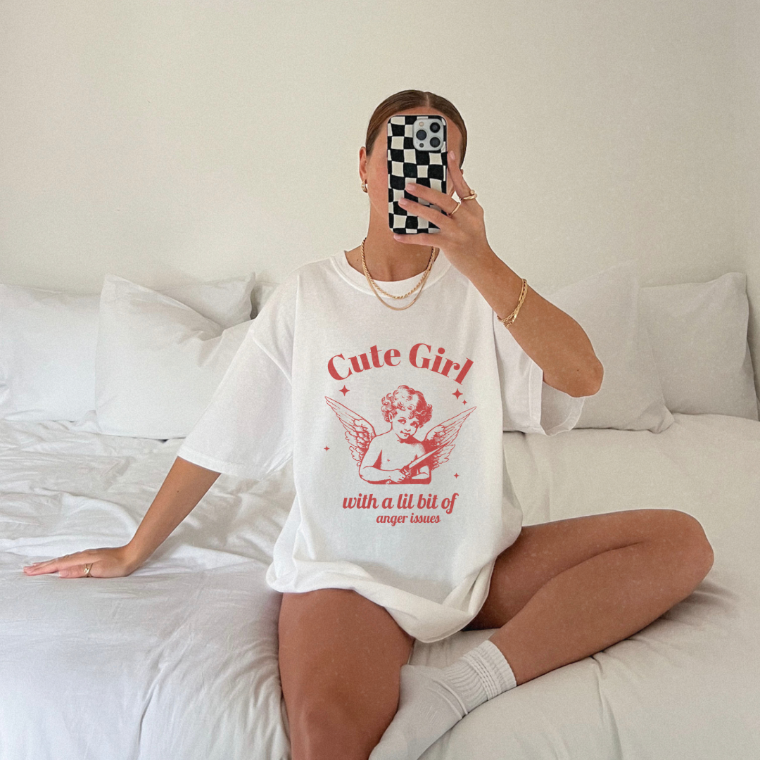 Vintage angel shirt with sassy angel print featuring a cute girl angel graphic. Oversized angel tee with retro vibes. Aesthetic angel shirt for casual looks. Funny retro angel tee with whimsical design. Unique angel tee for bold, stylish outfits.