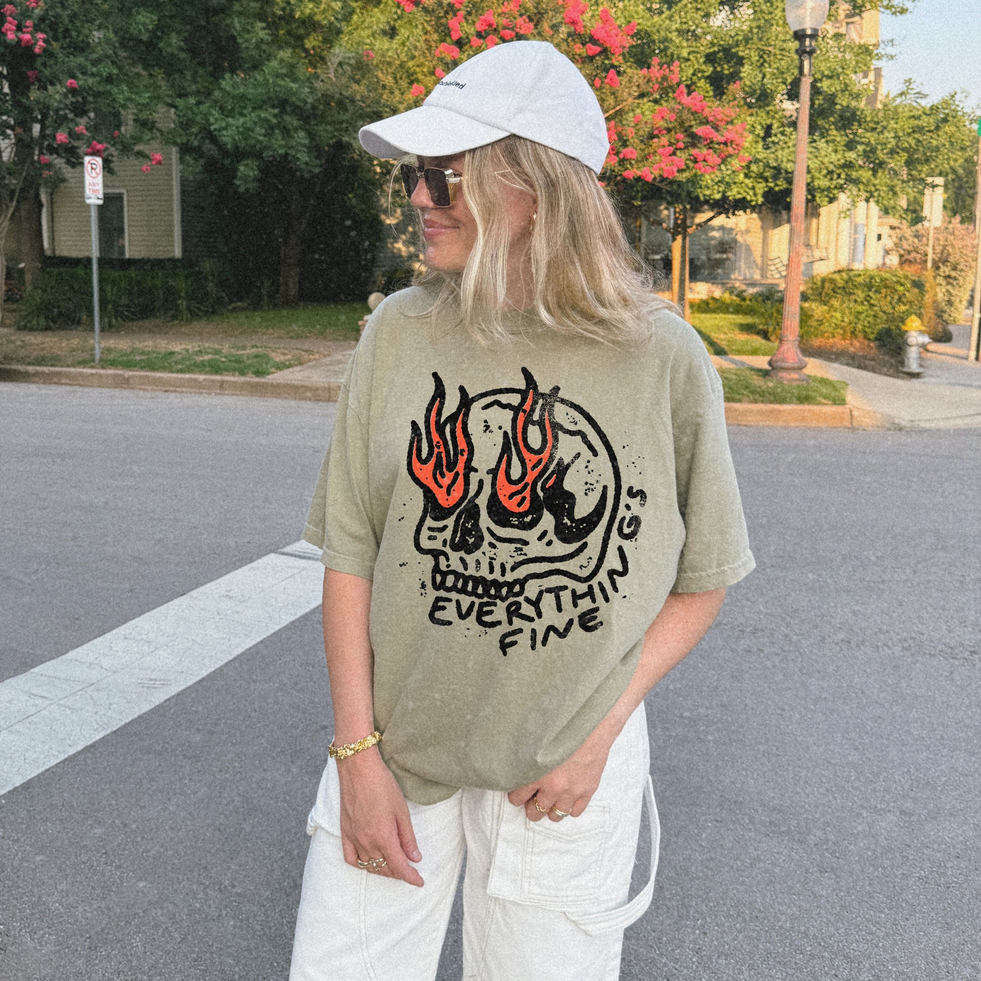 Distressed Skull Graphic T-Shirt with flames and bold grunge design. Oversized fit offers comfort and vintage-inspired edge for casual or streetwear outfits. 