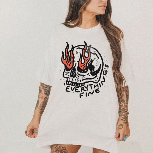 Distressed Skull Graphic T-Shirt with flames and bold grunge design. Oversized fit offers comfort and vintage-inspired edge for casual or streetwear outfits. 