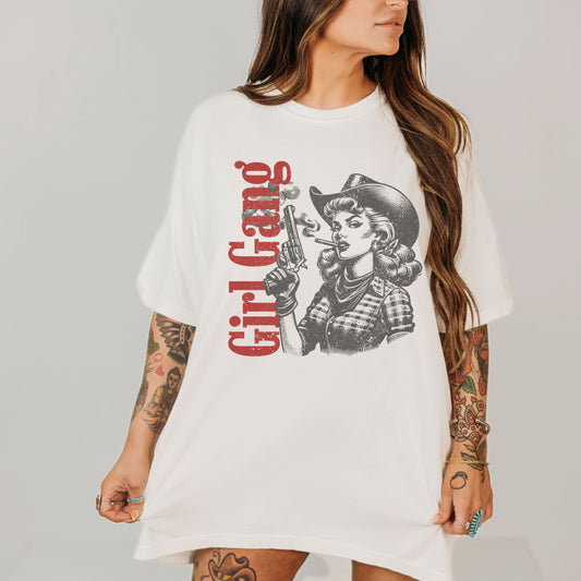 White t-shirt with graphic design and text worn by a person on a plain background