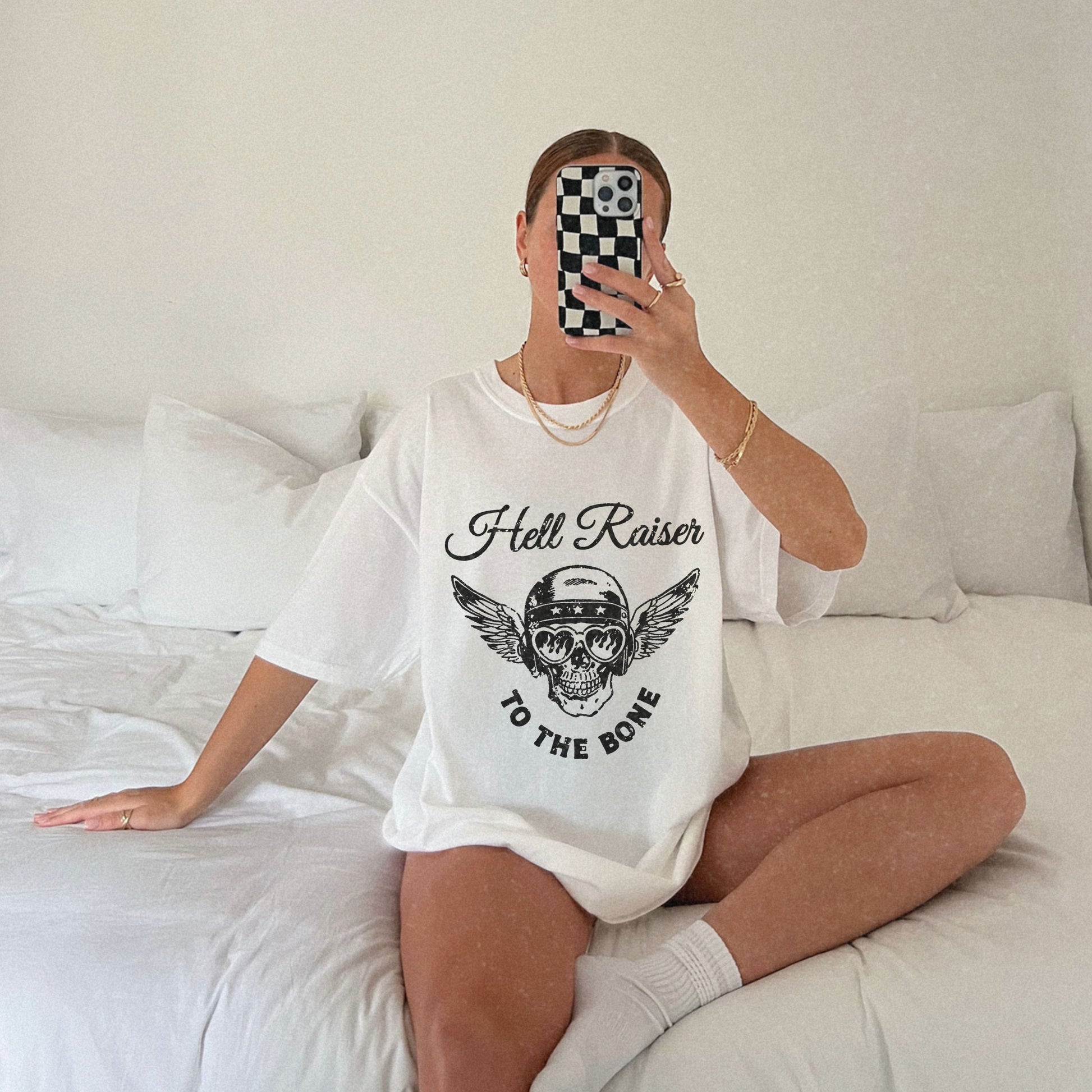 Graphic tee featuring a vintage-inspired winged skull and helmet design. Perfect for fans of retro biker style, rebel looks, and distressed rocker shirts. A badass, edgy option for casual wear with a unique skull and wings design.