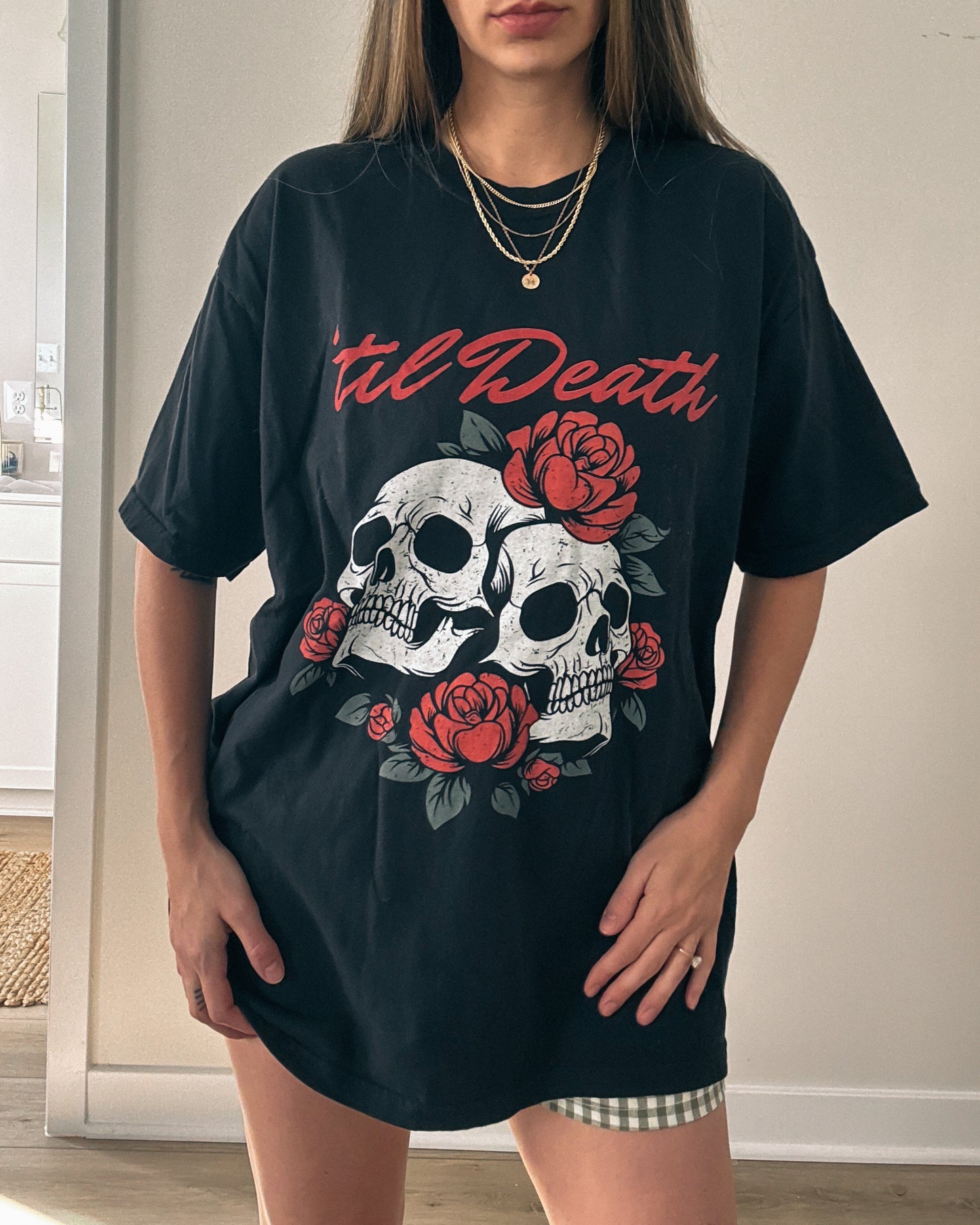 Graphic tee featuring a bold skull and roses design with vintage-inspired details. Perfect for fans of retro skeleton shirts, romantic gothic skull tees, or punk skull rose graphics. A unique aesthetic tattoo skull tee for edgy and dark romance lovers.