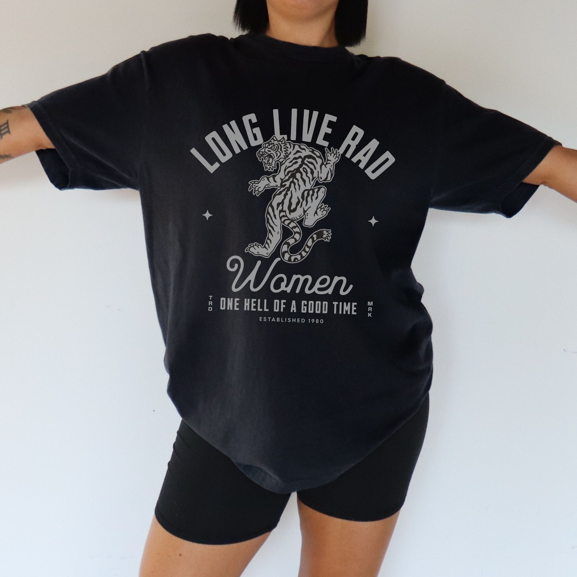 Rad Women Tee with vintage tiger graphic. 90s band graphic tee style with distressed rock tee aesthetic. Edgy women’s tee for a bold look. Western rock tee meets grunge style tee. Badass women tee with rebel graphic tee energy, perfect for everyday wear.