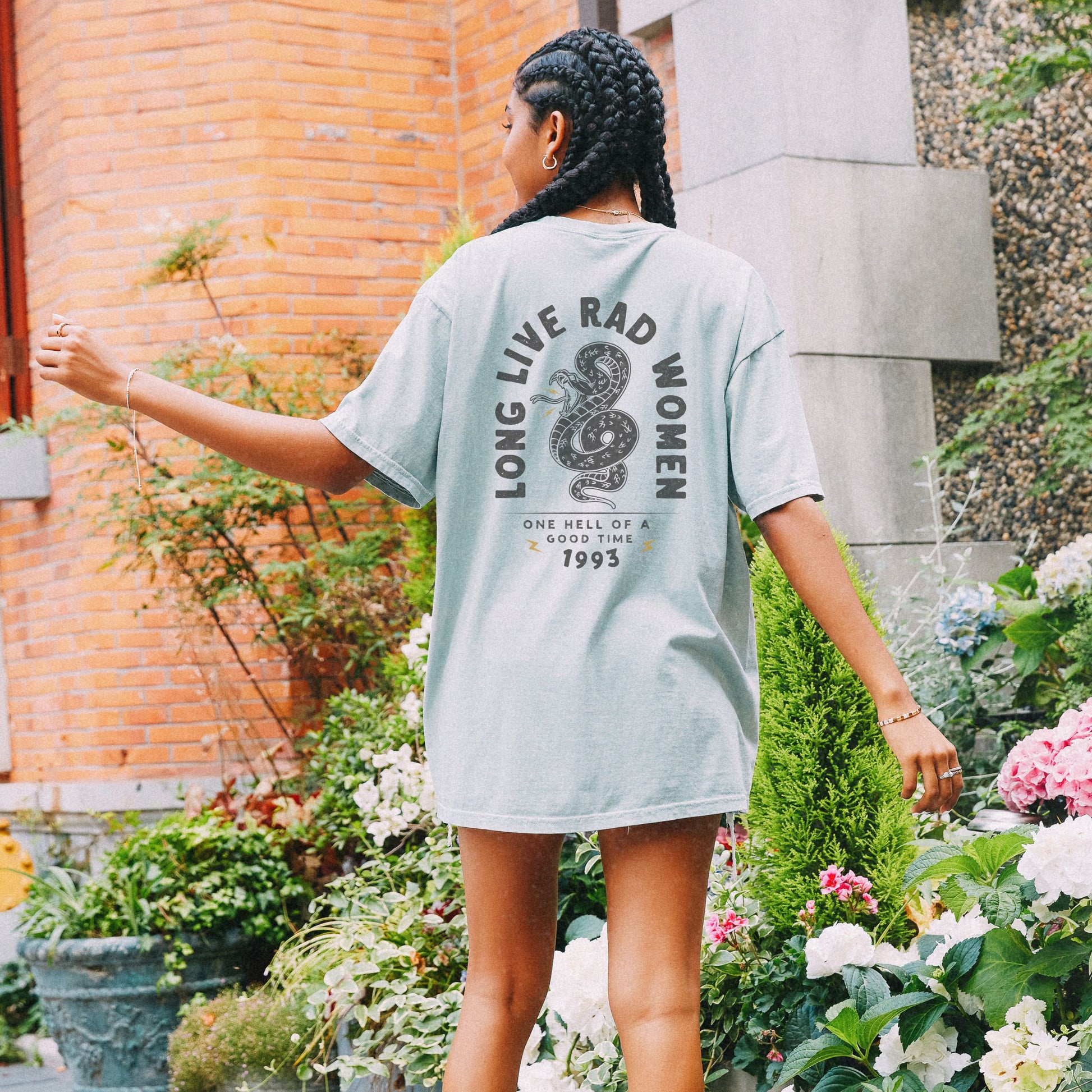 Long Live Rad Women retro snake tee, vintage cotton shirt with relaxed fit, feminist graphic tee, statement graphic tee, snake design tee, lightweight casual cotton tee, bold feminist shirt, 90s style t-shirt, graphic women tee for everyday wear.