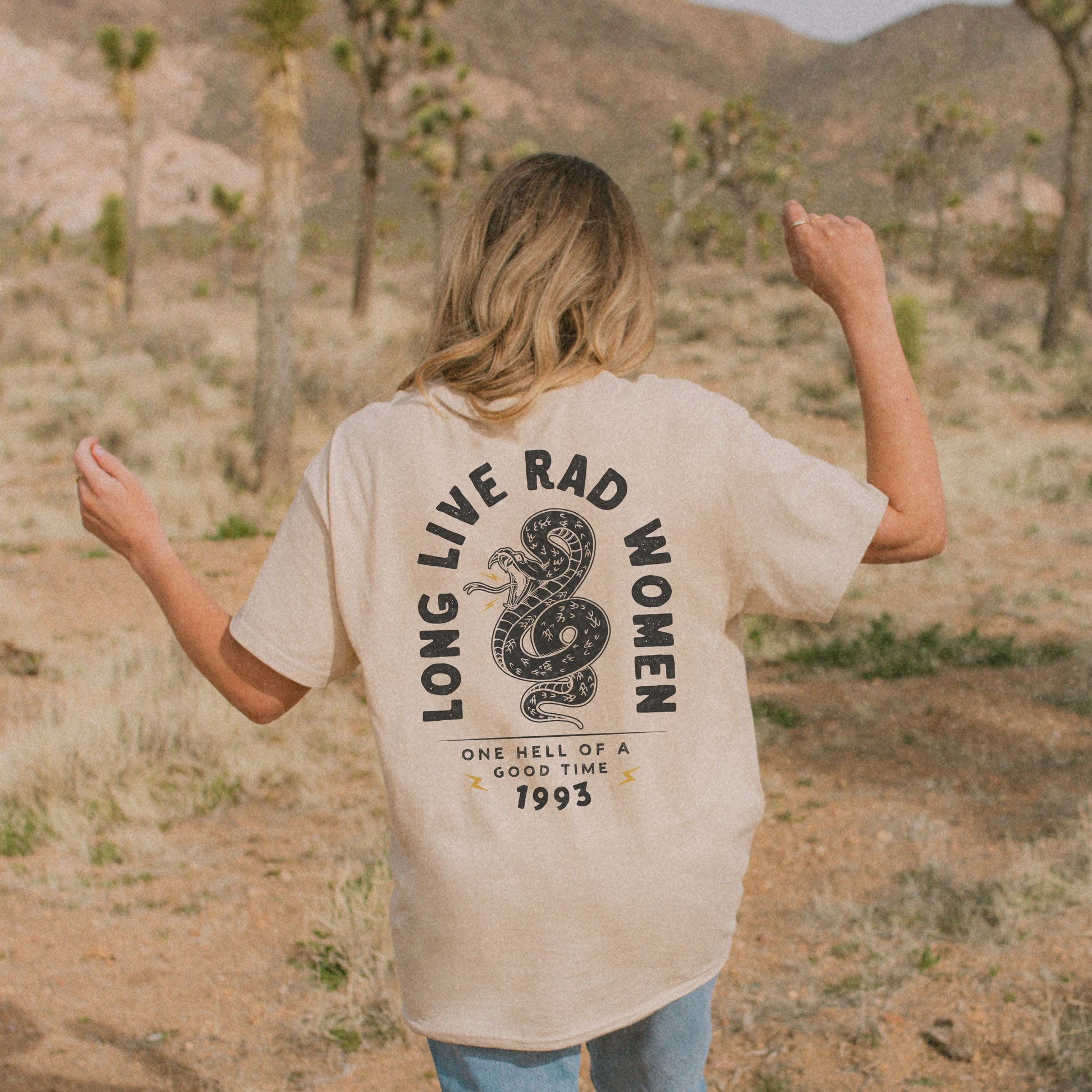 Long Live Rad Women retro snake tee, vintage cotton shirt with relaxed fit, feminist graphic tee, statement graphic tee, snake design tee, lightweight casual cotton tee, bold feminist shirt, 90s style t-shirt, graphic women tee for everyday wear.