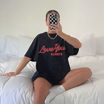 Love You Always graphic t-shirt in multiple colors, featuring bold red script text on a minimalist design. Perfect for Valentine’s Day, anniversaries, or everyday wear.