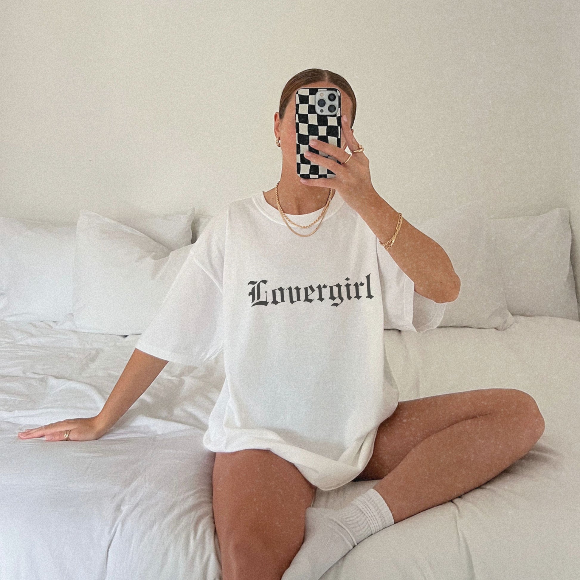 Vintage lovergirl tee in black with old English text font. Oversized casual fit perfect as a retro aesthetic shirt or edgy women’s graphic tee. Soft cotton black tee for everyday wear, combining minimalist style with trendy retro t-shirt vibes.