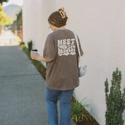 Retro Midwest shirt with bold floral graphic design and "Meet Me in the Midwest" text. Perfect for casual outfits, Midwest road trips, or trendy Midwest looks, combining comfort and style effortlessly. 