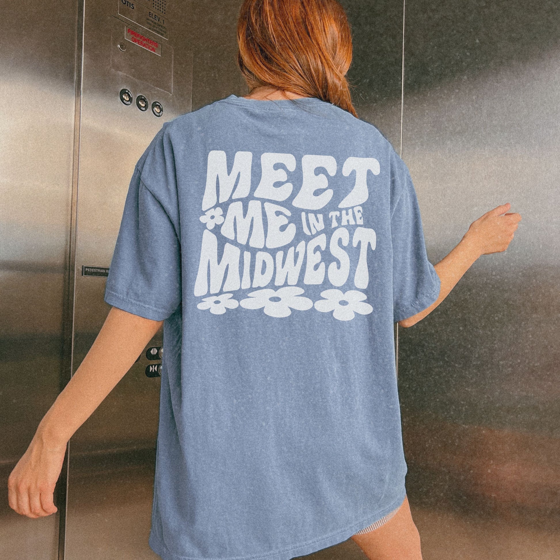 Retro Midwest shirt with bold floral graphic design and "Meet Me in the Midwest" text. Perfect for casual outfits, Midwest road trips, or trendy Midwest looks, combining comfort and style effortlessly. 
