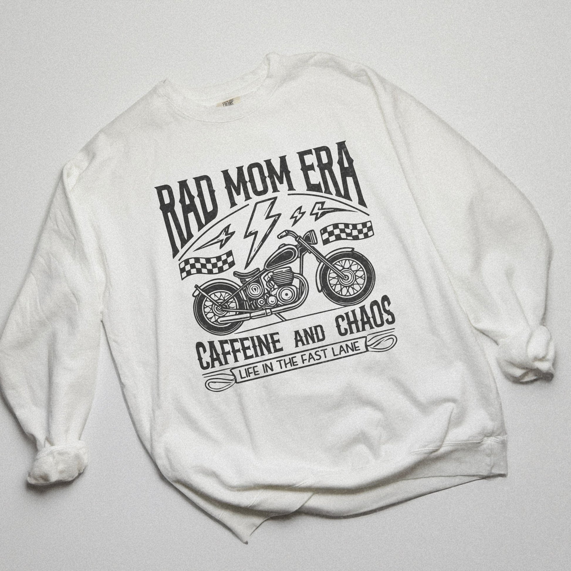 Rad mom graphic tee featuring a vintage motorcycle design with bold text. Perfect for edgy mom style, this trendy mom sweatshirt embodies caffeine chaos vibes and retro mom life. Great for biker moms or stylish moms seeking a casual yet bold look.