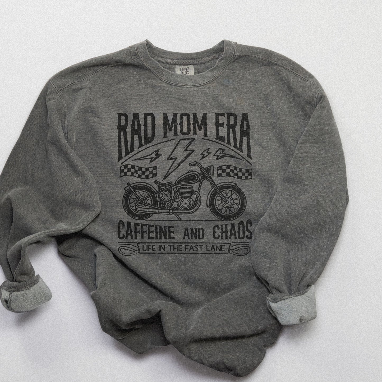Rad mom graphic tee featuring a vintage motorcycle design with bold text. Perfect for edgy mom style, this trendy mom sweatshirt embodies caffeine chaos vibes and retro mom life. Great for biker moms or stylish moms seeking a casual yet bold look.