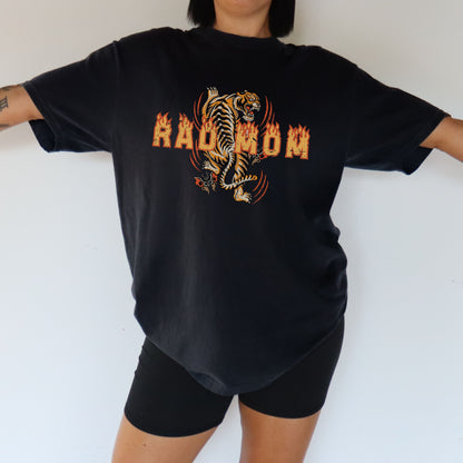 Rad mom graphic tee featuring bold vintage tiger design with flame details. Cool mom streetwear shirt with retro tattoo style graphic perfect for everyday edgy mom style and bold vintage inspired streetwear.