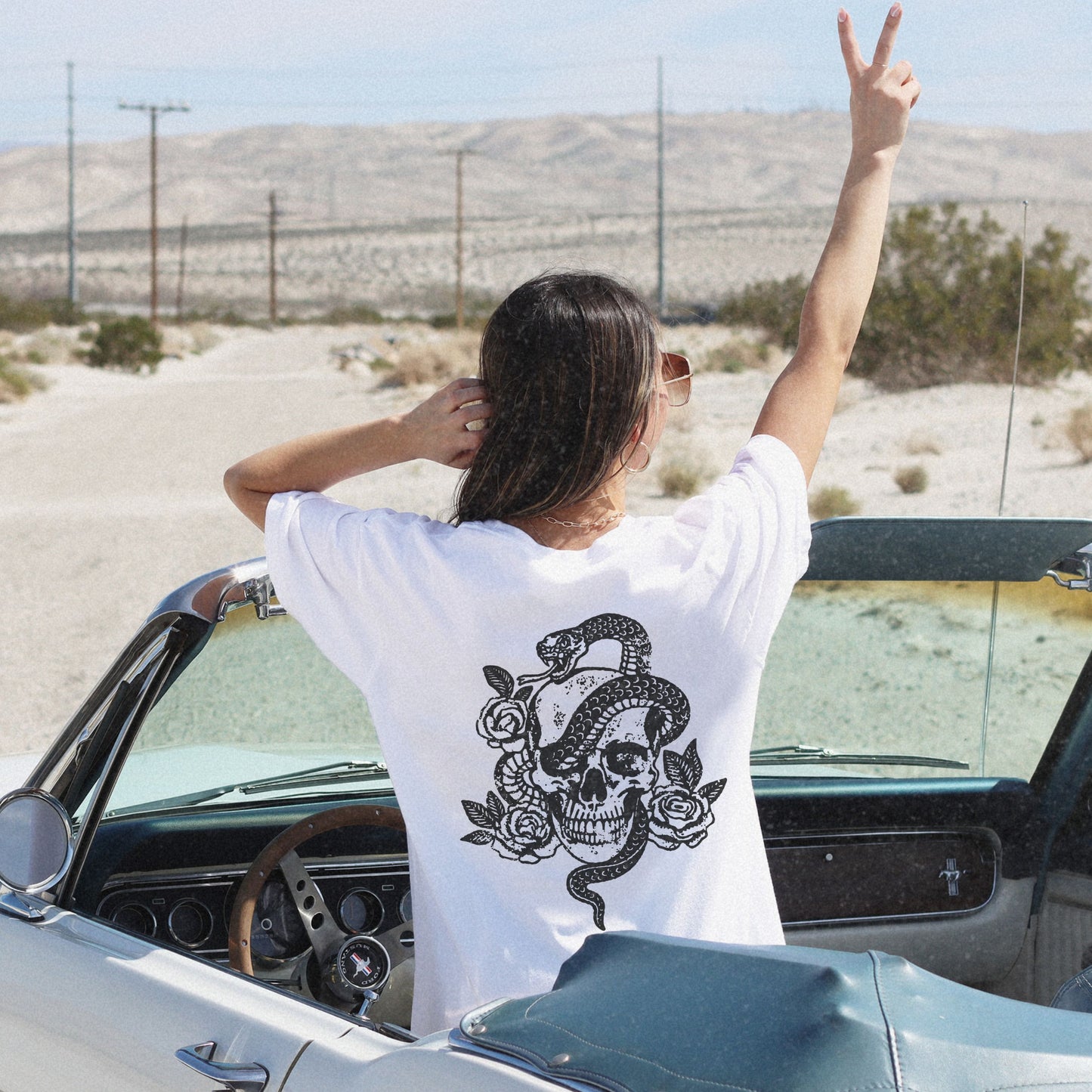 Snake skull shirt with a bold skull, rose, and snake design, blending edgy and gothic vibes. This dark graphic tee is ideal for fans of retro snake shirts, witchy skeleton tees, or unique rose t-shirts seeking a vintage gothic aesthetic for everyday wear.