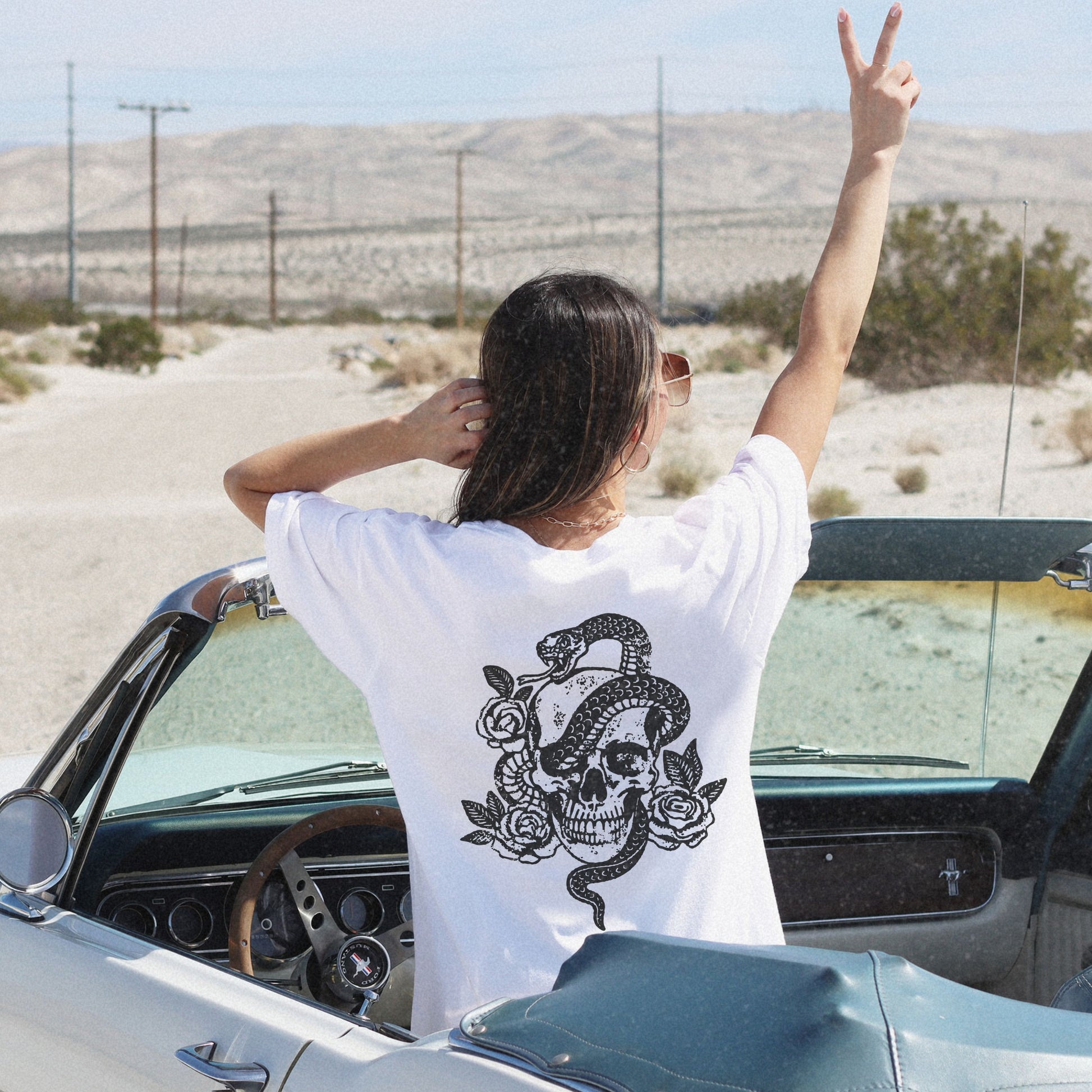 Snake skull shirt with a bold skull, rose, and snake design, blending edgy and gothic vibes. This dark graphic tee is ideal for fans of retro snake shirts, witchy skeleton tees, or unique rose t-shirts seeking a vintage gothic aesthetic for everyday wear.