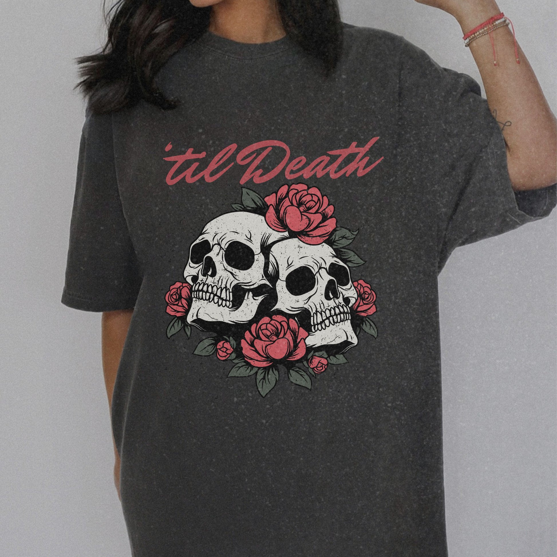 Graphic tee featuring a bold skull and roses design with vintage-inspired details. Perfect for fans of retro skeleton shirts, romantic gothic skull tees, or punk skull rose graphics. A unique aesthetic tattoo skull tee for edgy and dark romance lovers.