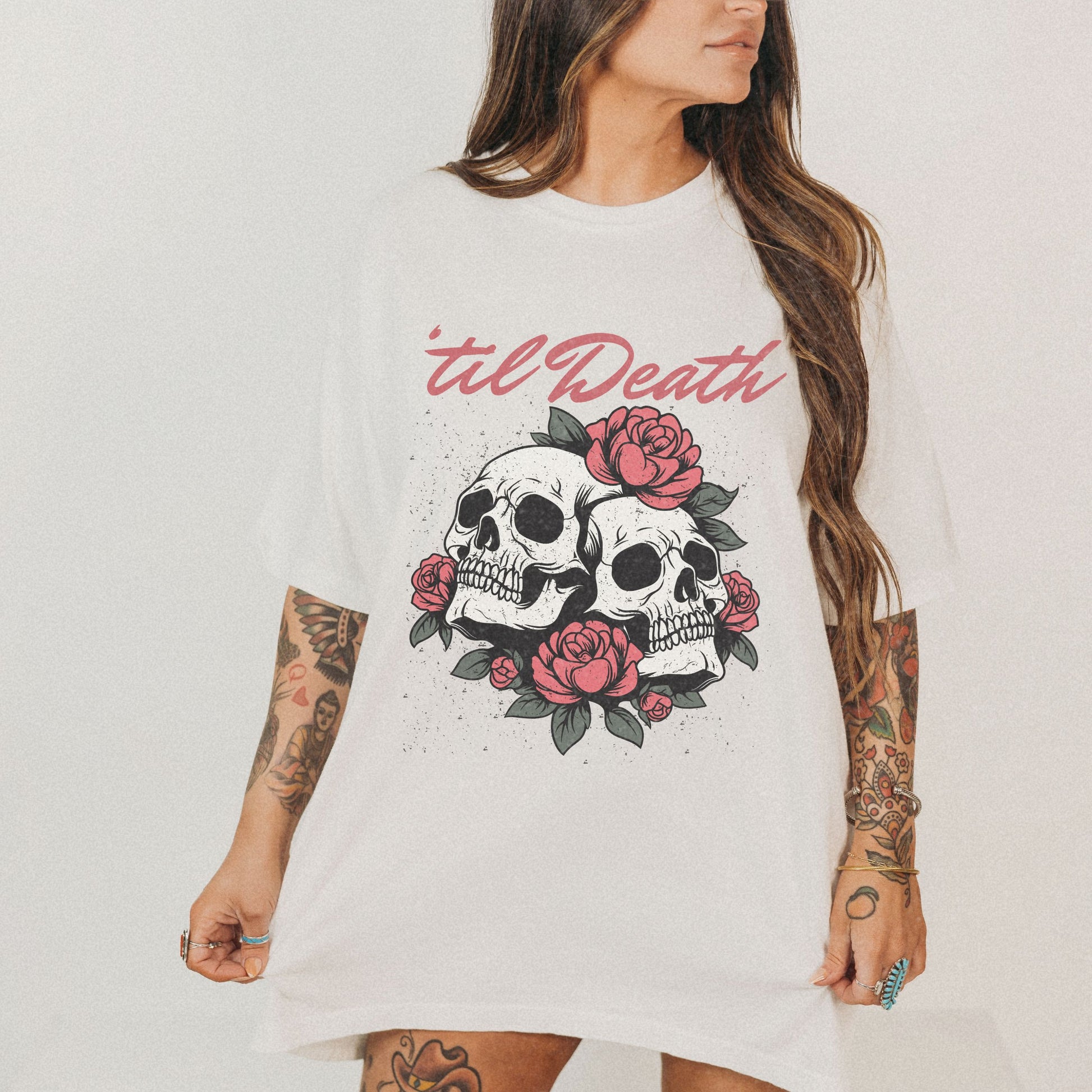 Graphic tee featuring a bold skull and roses design with vintage-inspired details. Perfect for fans of retro skeleton shirts, romantic gothic skull tees, or punk skull rose graphics. A unique aesthetic tattoo skull tee for edgy and dark romance lovers.