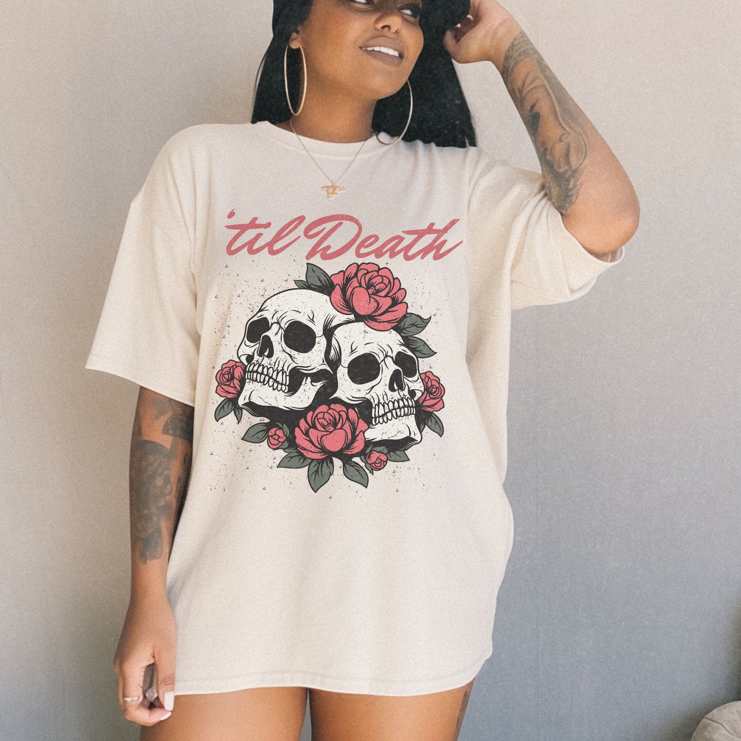 Graphic tee featuring a bold skull and roses design with vintage-inspired details. Perfect for fans of retro skeleton shirts, romantic gothic skull tees, or punk skull rose graphics. A unique aesthetic tattoo skull tee for edgy and dark romance lovers.
