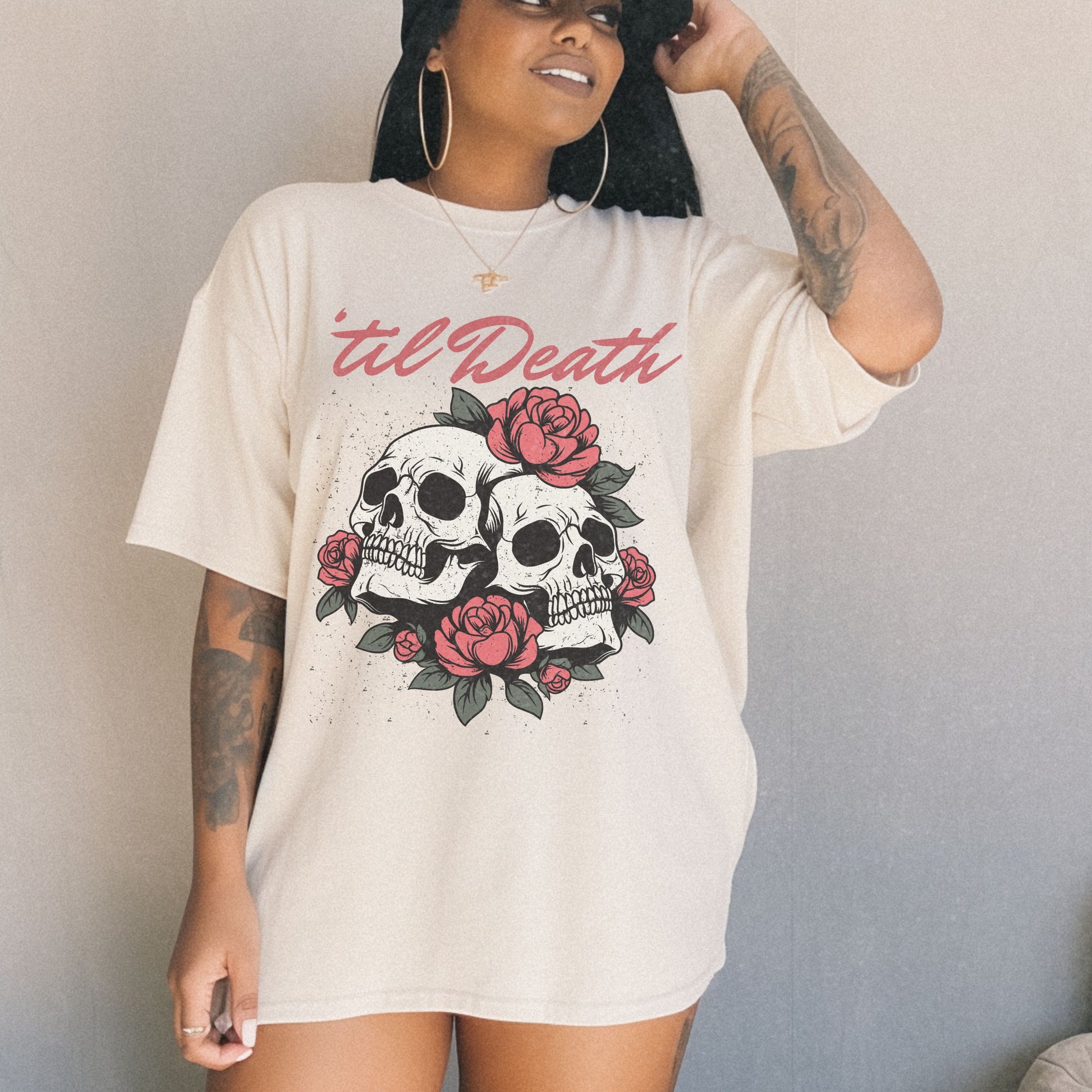 Graphic tee featuring a bold skull and roses design with vintage-inspired details. Perfect for fans of retro skeleton shirts, romantic gothic skull tees, or punk skull rose graphics. A unique aesthetic tattoo skull tee for edgy and dark romance lovers.