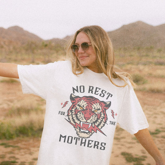 Bold tiger graphic on a No Rest for Mothers Tee, designed for empowered moms. This Tiger Mom Graphic Tee and Vintage Mom Graphic Tee combines retro flair with edgy style. Perfect for casual wear, gifting, or embracing mom life with confidence.