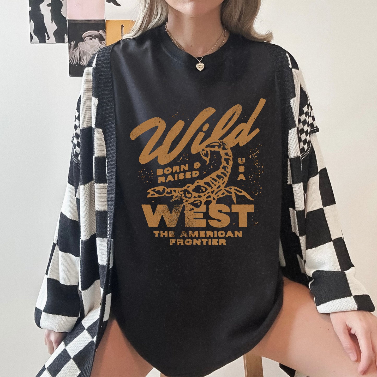 Vintage western shirt with a scorpion graphic and distressed details. Retro cowboy t-shirt inspired by the American West. Rodeo graphic t-shirt with a rustic frontier style. Wild West graphic tee with a bold design for a rugged, adventurous look.