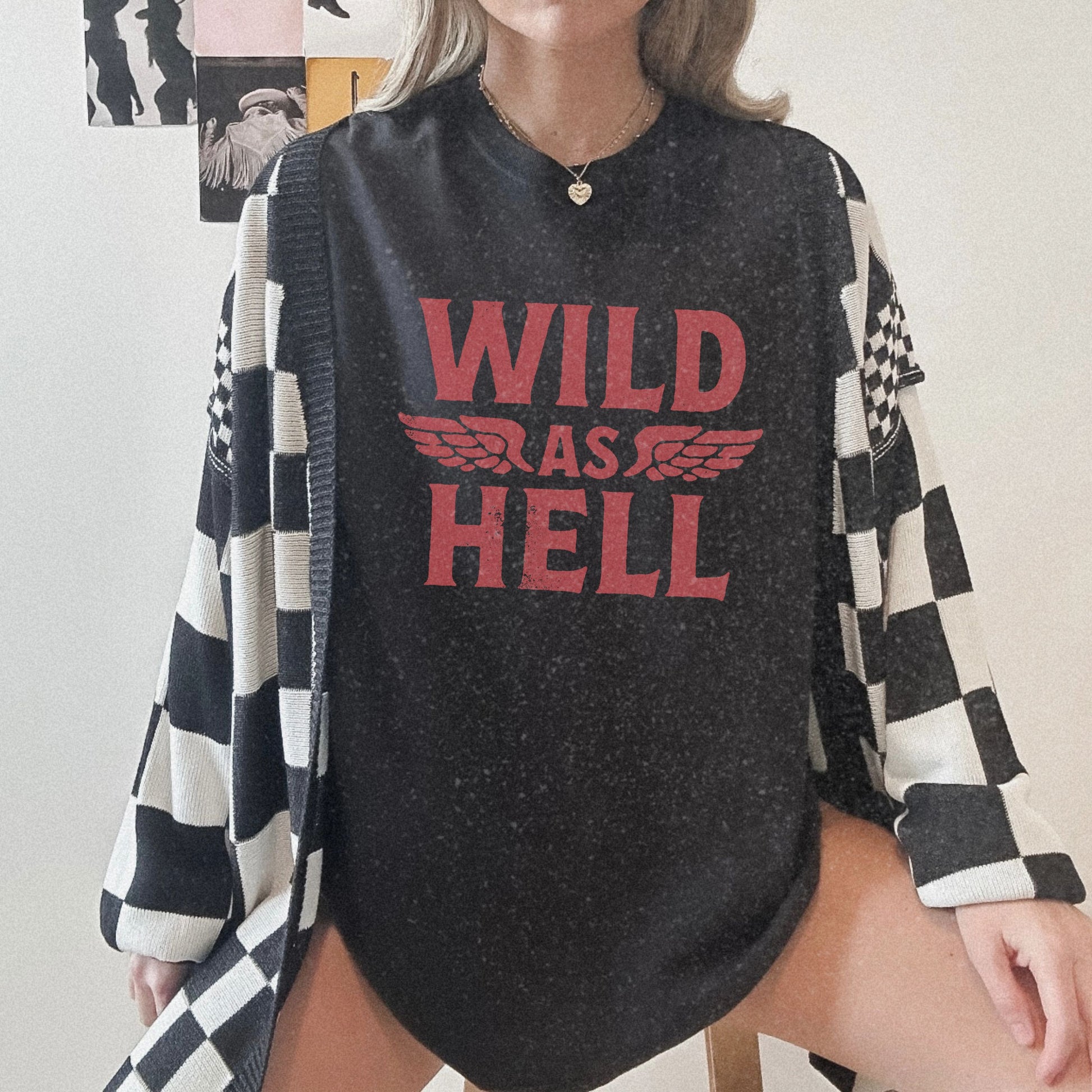 Wild as Hell shirt featuring bold red retro slogan design on a soft oversized tee, perfect for women seeking 90s aesthetic vibes, feminist graphic style, or edgy biker fashion. Ideal for grunge, punk rock, or vintage rebel looks.